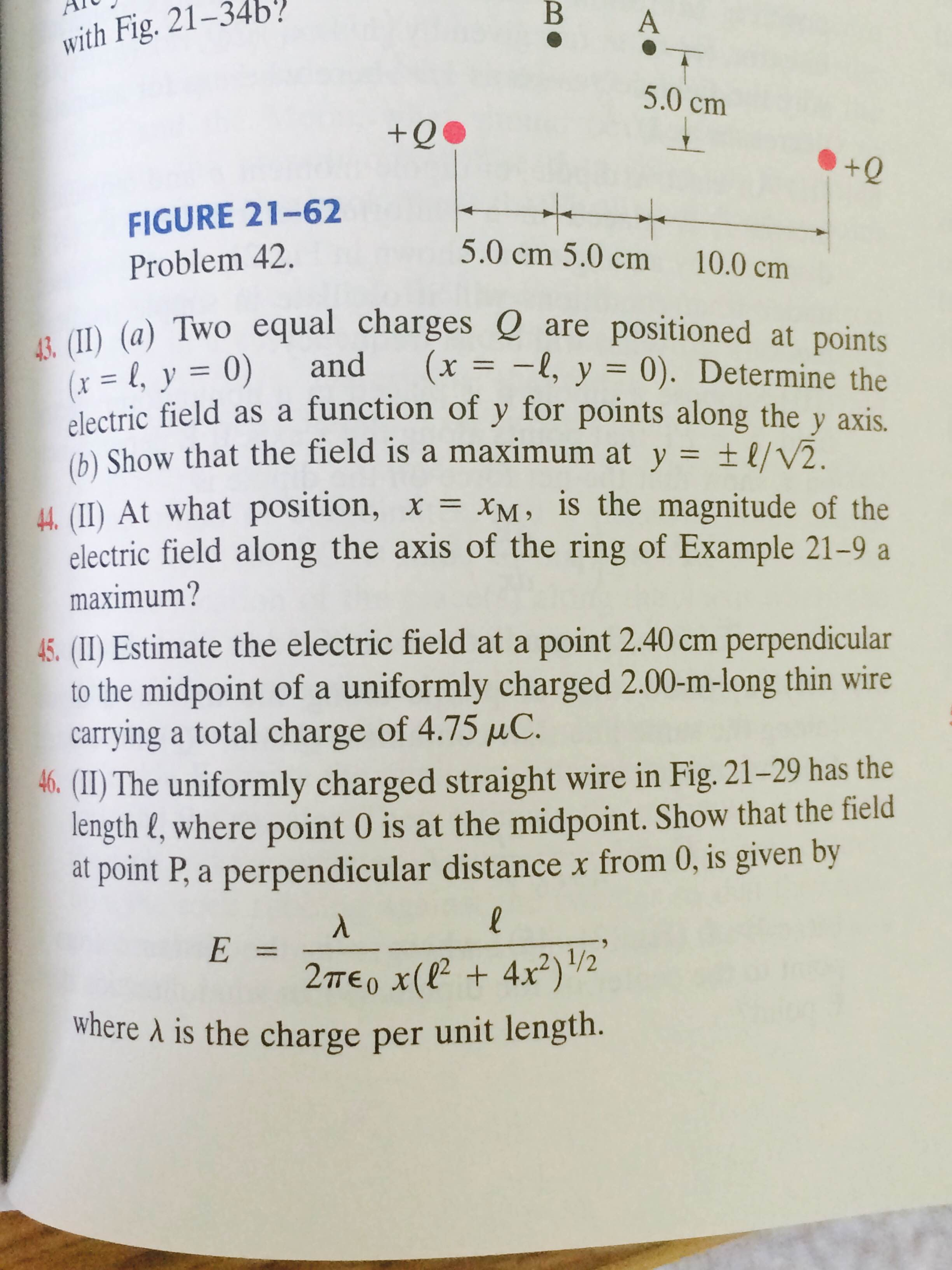 Solved Two Equal Charges Q Are Positioned At Points X Chegg Com