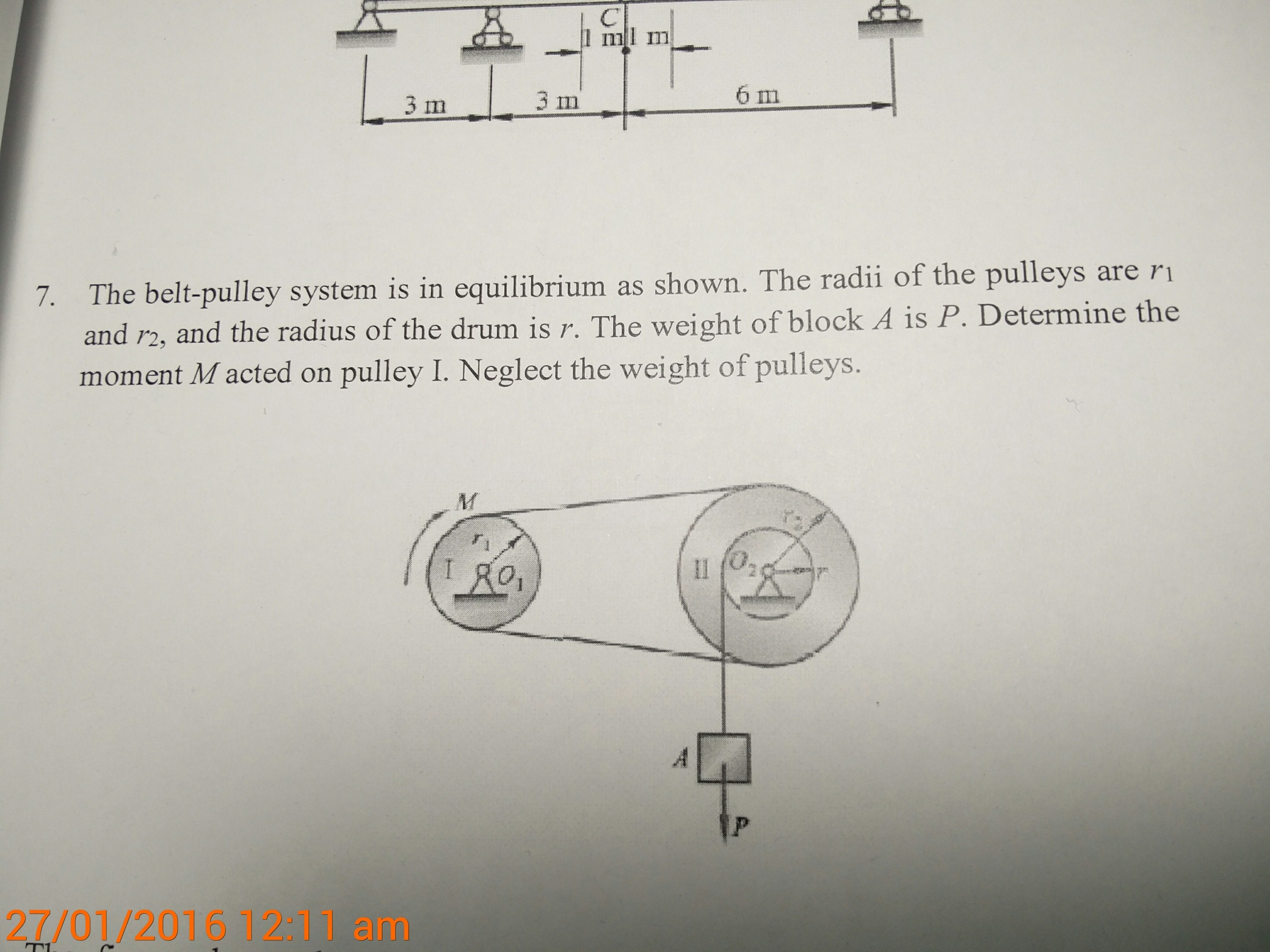 Solved The belt pulley system is in equilibrium as shown.