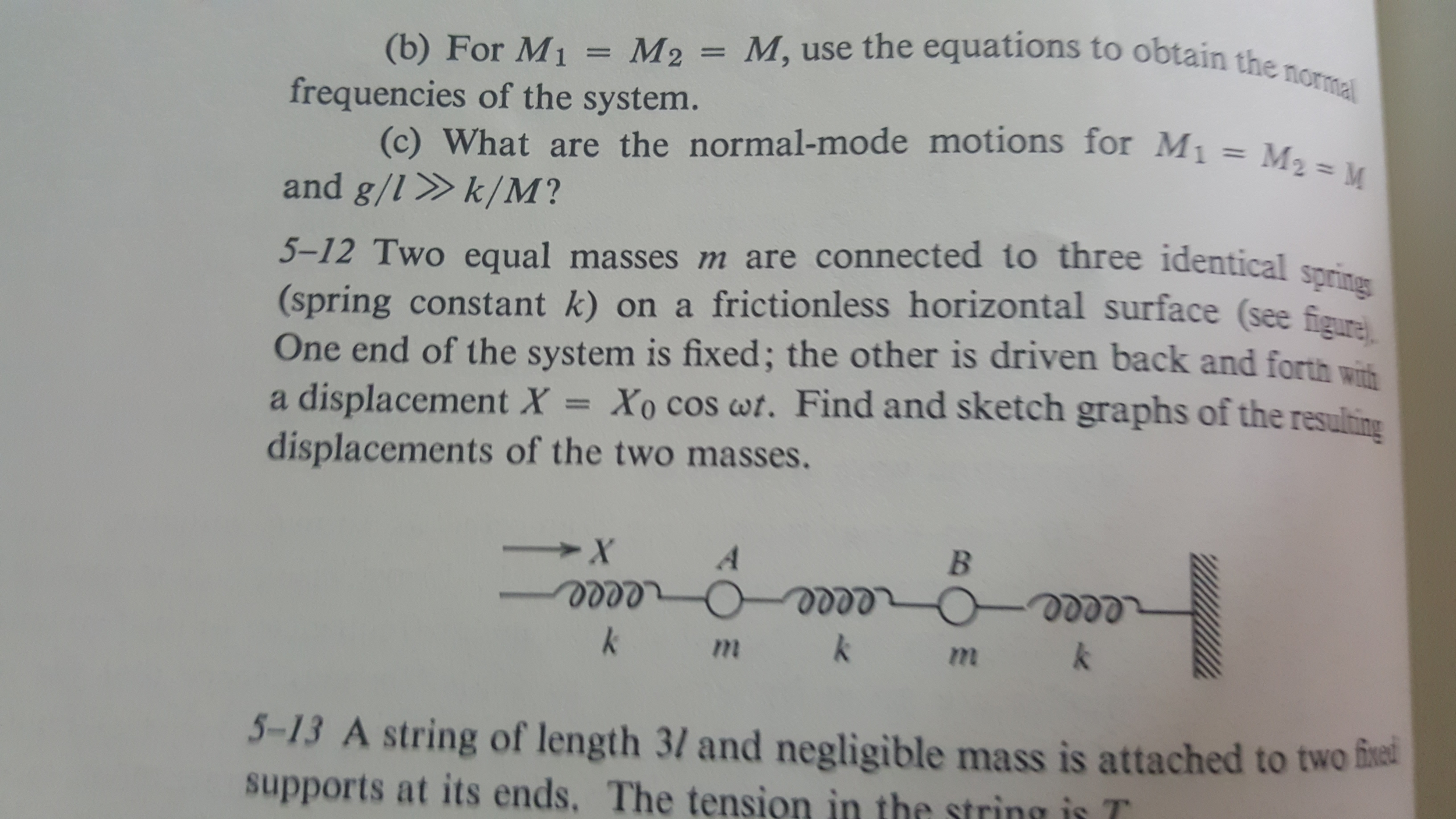 Solved Two equal masses m are connected to three identical