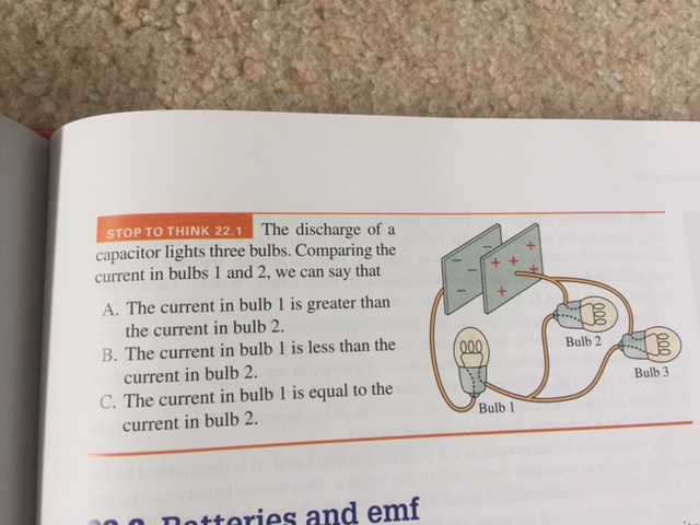 Solved The discharge of a capacitor lights three bulbs. | Chegg.com